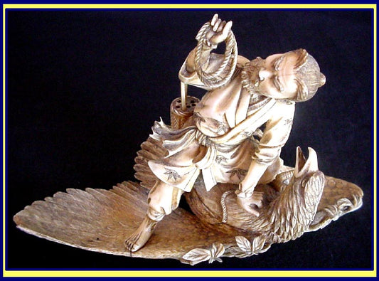 Antique Japanese Okimono hunter capturing eagle carved statue